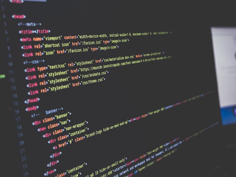 Source code on a developer's monitor during a website build